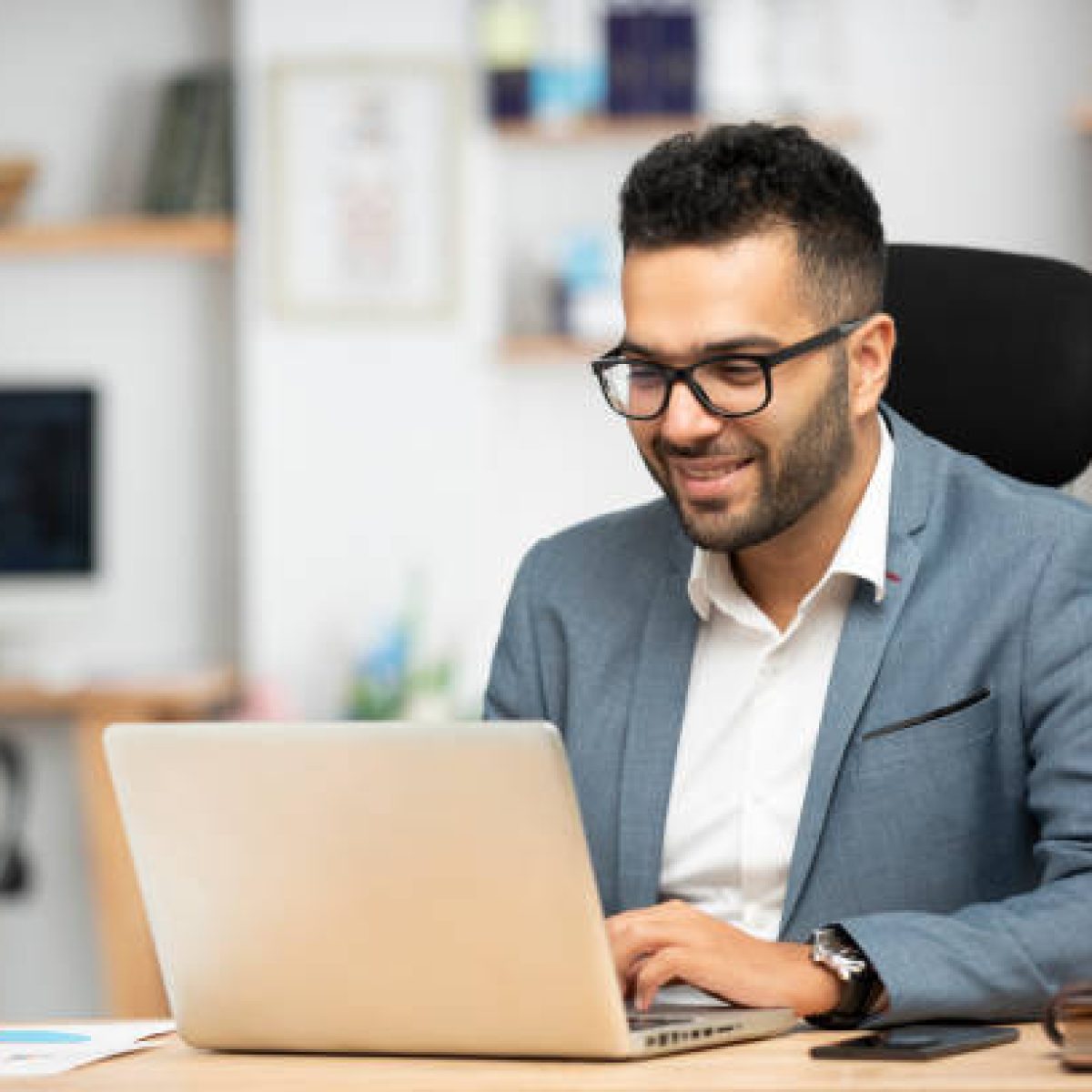 Portrait of a handsome young businessman working in office